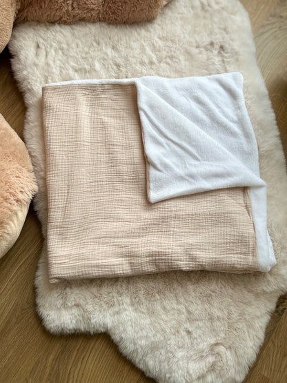 Couverture en gaze de coton et son intérieur polaire