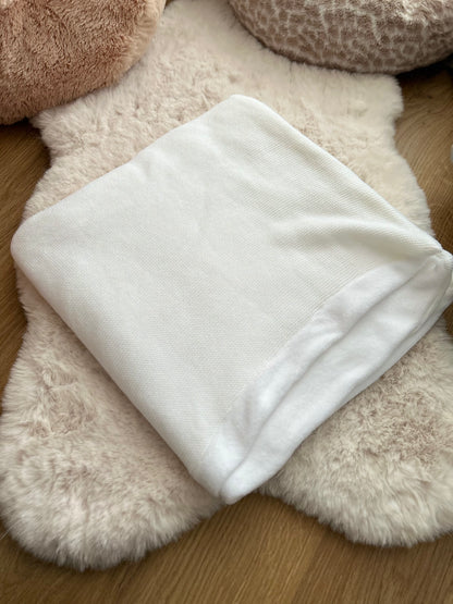 Couverture en maille et son intérieur polaire